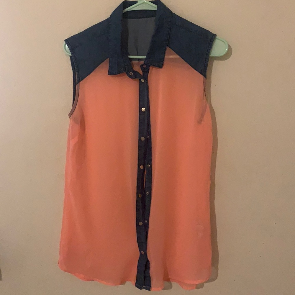 The top coral shirt with the blue jean collar